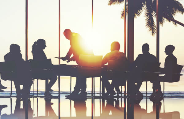 Company Meeting with Palm Tree in Background